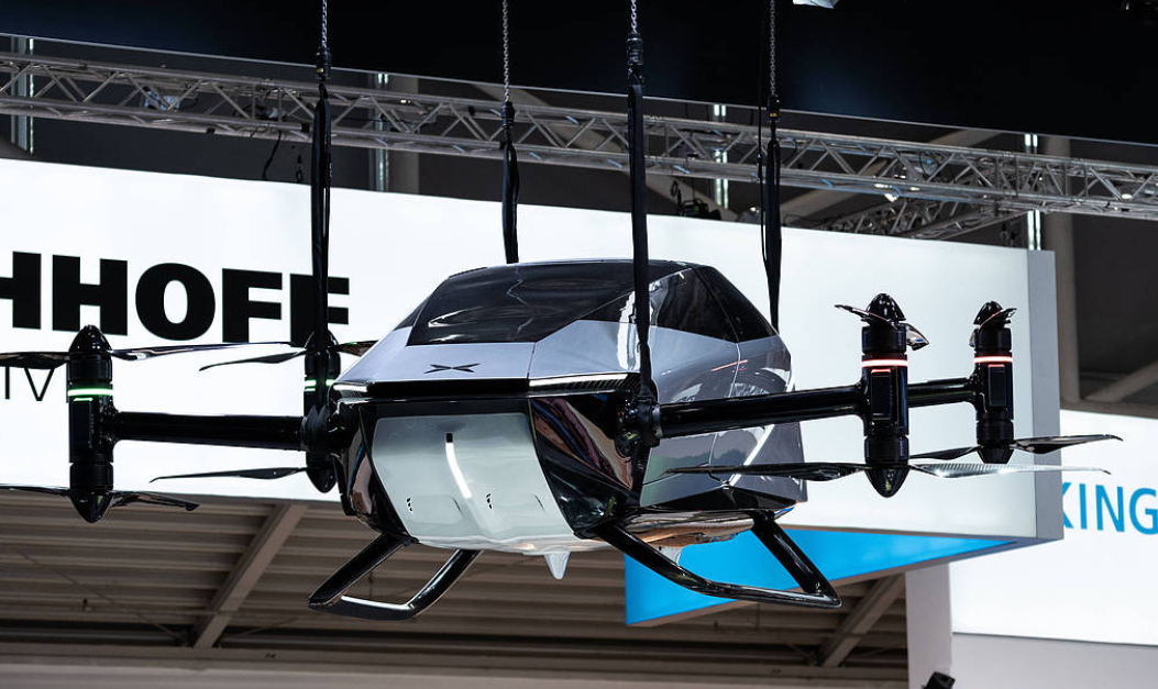 A mid-air collision between two flying cars during an airshow